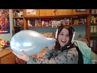 gamer girl burstings a blue balloon