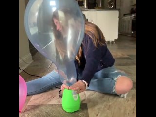 pumping a blue balloon to pop for fun
