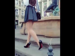 legs of a girl in a short skirt